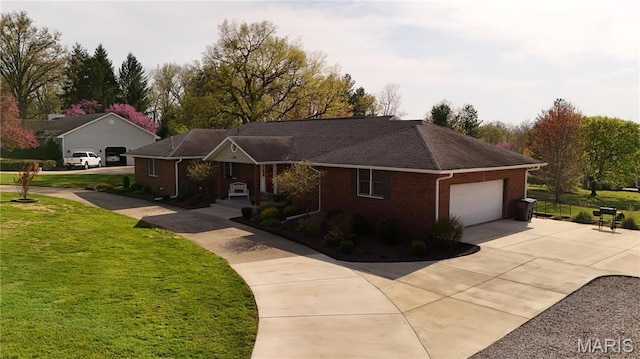 705 Linder Blvd, Greenville, IL 62246 - ranch-style house with concrete driveway, an attached garage, a front lawn, and brick siding