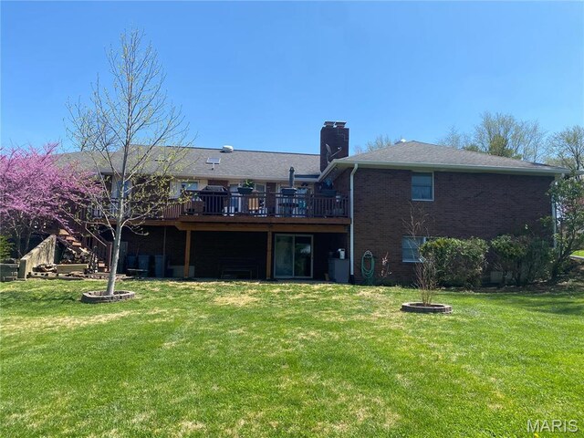 705 Linder Blvd, Greenville, IL 62246 - rear view of house with a deck, a chimney, a yard, and brick siding