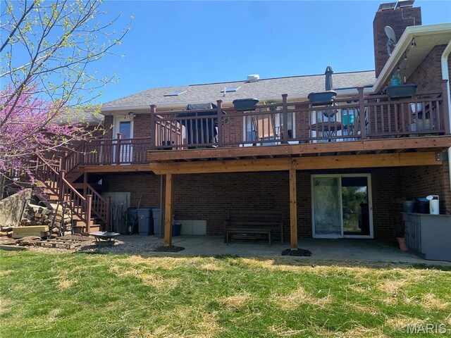 705 Linder Blvd, Greenville, IL 62246 - back of property with brick siding, a patio area, a deck, a yard, and stairs