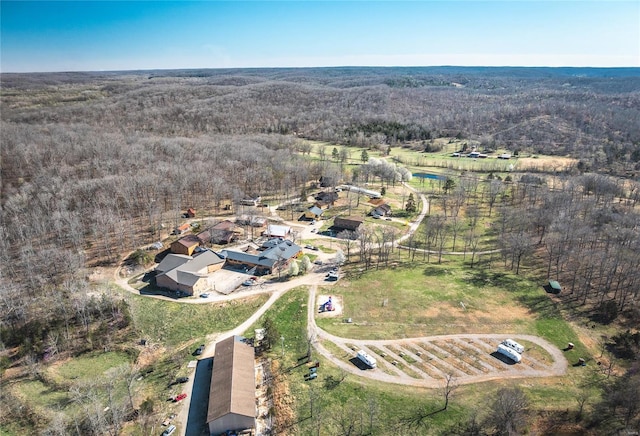 view of property location featuring a heavily wooded area