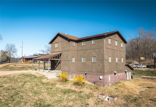back of house with a yard
