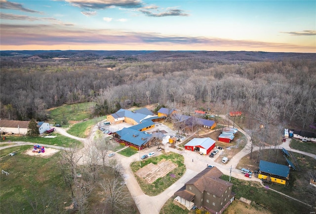 aerial view at dusk of a wooded view