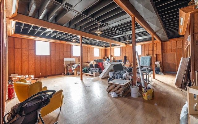 below grade area with wood finished floors and wood walls