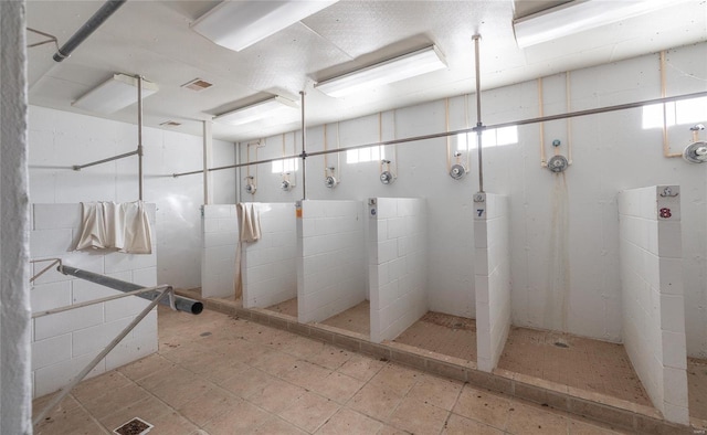 bathroom with tiled shower