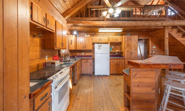 kitchen with white appliances, tile counters, wood ceiling, light wood-style flooring, and a sink