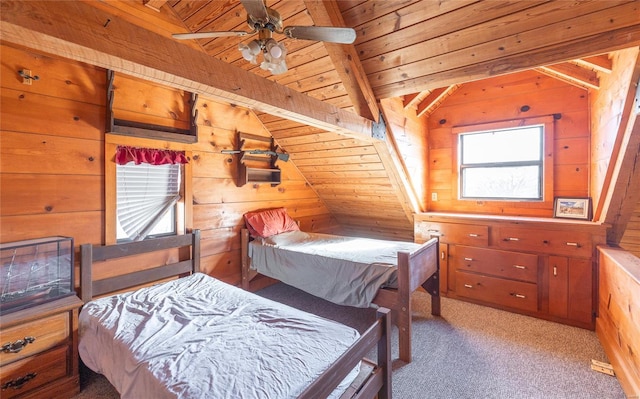 bedroom featuring wood walls, wooden ceiling, and carpet flooring