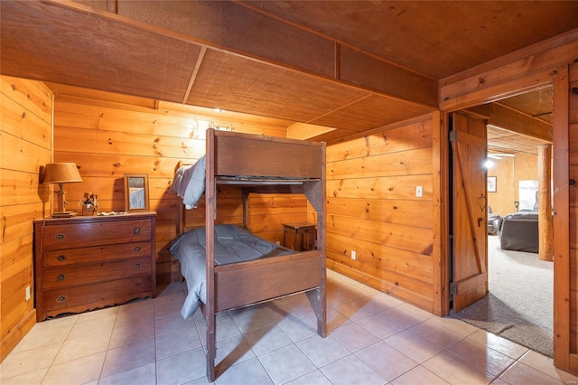tiled bedroom featuring wood walls and wood ceiling