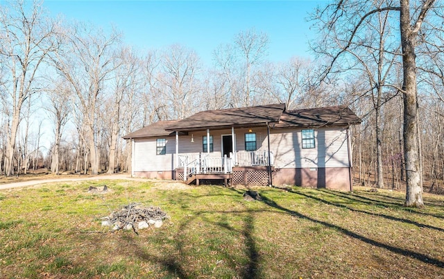 ranch-style home featuring a porch and a front yard