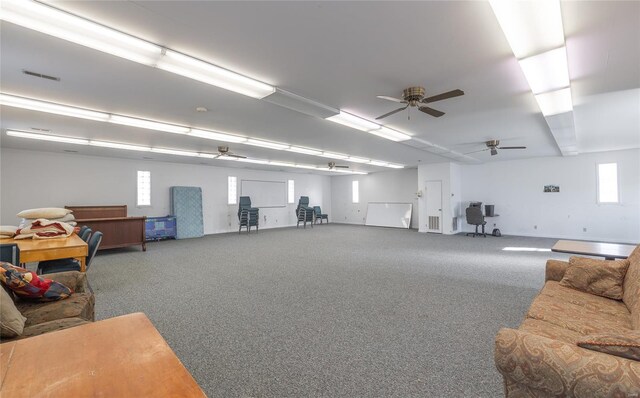 misc room featuring carpet and a ceiling fan
