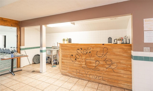 reception featuring tile walls