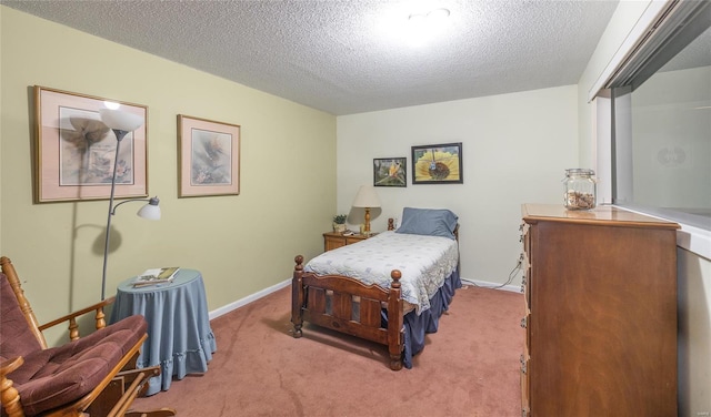 bedroom featuring light carpet, a textured ceiling, and baseboards