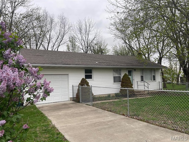 ranch-style house with an attached garage and concrete driveway