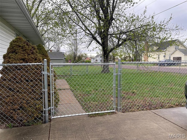 view of yard with a gate