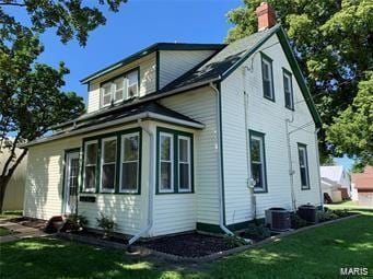 108 Rau St, Waterloo, IL 62298 - back of property with a chimney and a yard