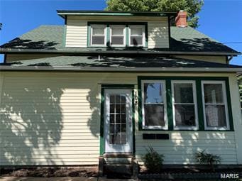 108 Rau St, Waterloo, IL 62298 - rear view of house with entry steps and a chimney