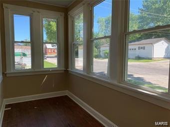 108 Rau St, Waterloo, IL 62298 - unfurnished sunroom with baseboards, healthy amount of natural light, and wood finished floors