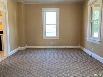108 Rau St, Waterloo, IL 62298 - carpeted empty room featuring baseboards and crown molding
