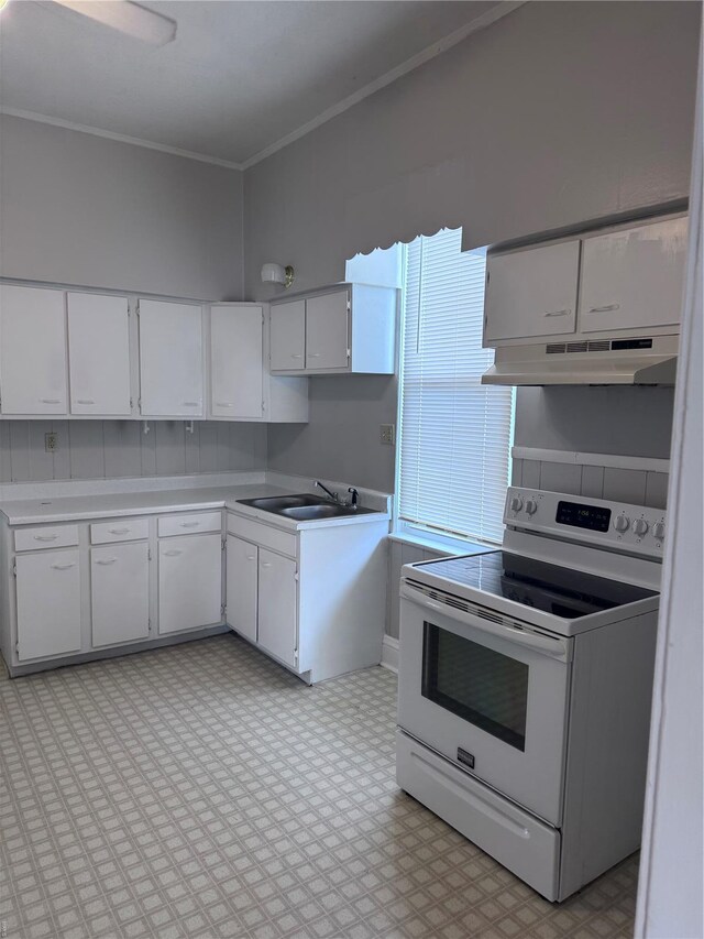 108 Rau St, Waterloo, IL 62298 - kitchen with white electric stove, under cabinet range hood, light countertops, light floors, and a sink