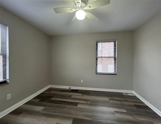4232 Jennings Station Rd, Saint Louis, MO 63121 - unfurnished room with baseboards, dark wood-style flooring, and a ceiling fan