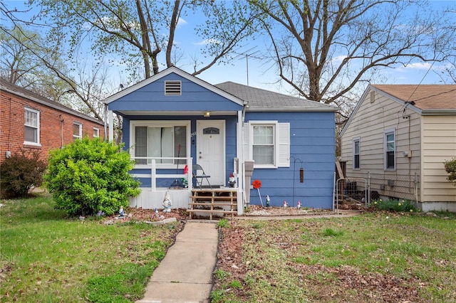 248 S Barat Ave, Ferguson, MO 63135 - view of front of property with a front yard, a porch, and a shingled roof