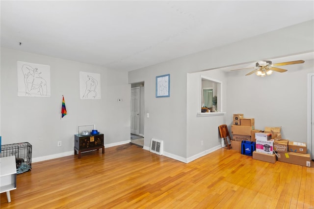 248 S Barat Ave, Ferguson, MO 63135 - game room featuring light wood-style floors, ceiling fan, and baseboards