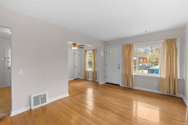 248 S Barat Ave, Ferguson, MO 63135 - foyer entrance featuring ceiling fan, light wood-style flooring, and baseboards