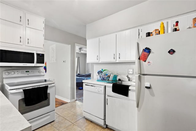 248 S Barat Ave, Ferguson, MO 63135 - kitchen featuring white appliances, light countertops, white cabinets, and ceiling fan