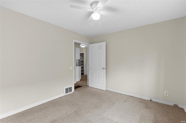 248 S Barat Ave, Ferguson, MO 63135 - unfurnished room featuring carpet, baseboards, and a ceiling fan