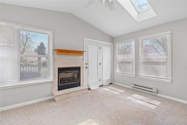 248 S Barat Ave, Ferguson, MO 63135 - unfurnished living room with baseboard heating, a high end fireplace, a ceiling fan, lofted ceiling, and plenty of natural light