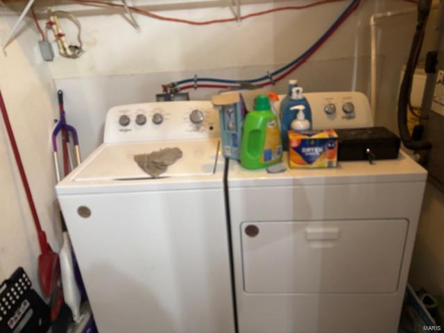 laundry room featuring separate washer and dryer
