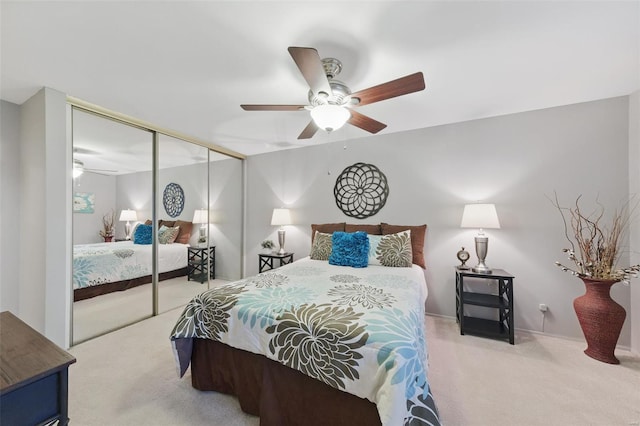 bedroom featuring carpet, a closet, and ceiling fan