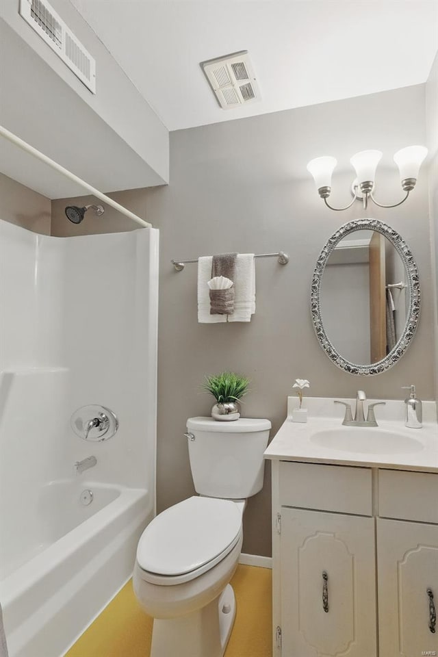 bathroom featuring vanity, toilet, and washtub / shower combination