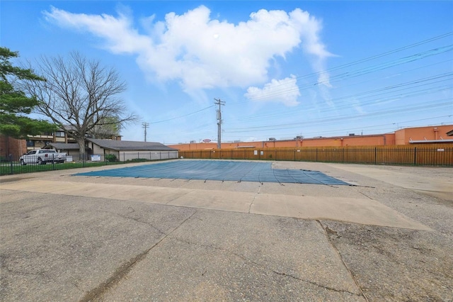 view of pool with fence and a patio