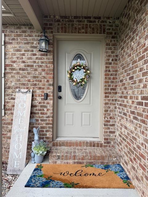 1607 Enterprise Ct, Jackson, MO 63755 - doorway to property featuring brick siding