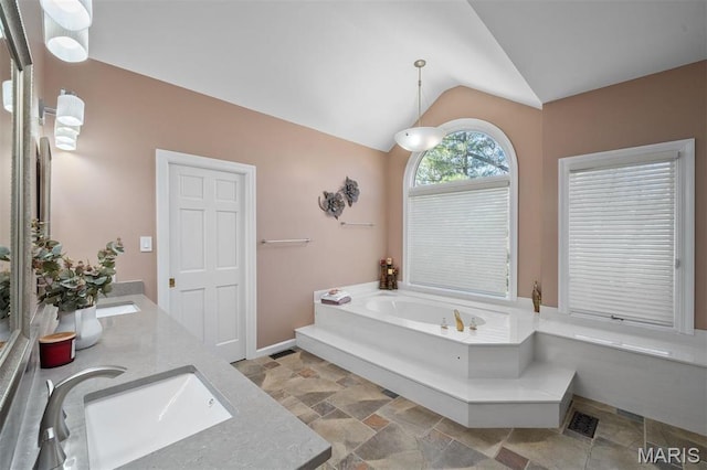 1416 Haarman Oak Dr, Wildwood, MO 63005 - full bath featuring stone tile flooring, lofted ceiling, double vanity, and a garden tub