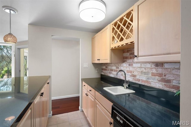 1416 Haarman Oak Dr, Wildwood, MO 63005 - kitchen featuring dark countertops, tasteful backsplash, light tile patterned flooring, dishwasher, and pendant lighting