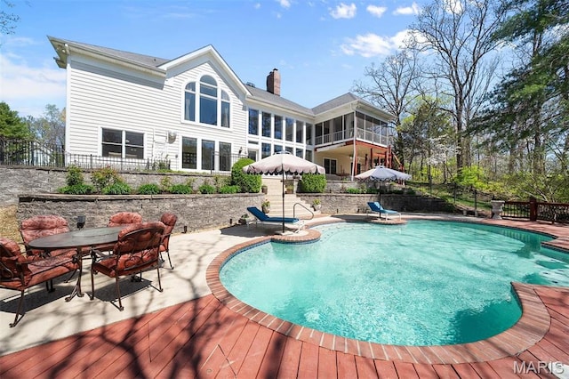 1416 Haarman Oak Dr, Wildwood, MO 63005 - view of swimming pool featuring a wooden deck, outdoor dining space, and a patio