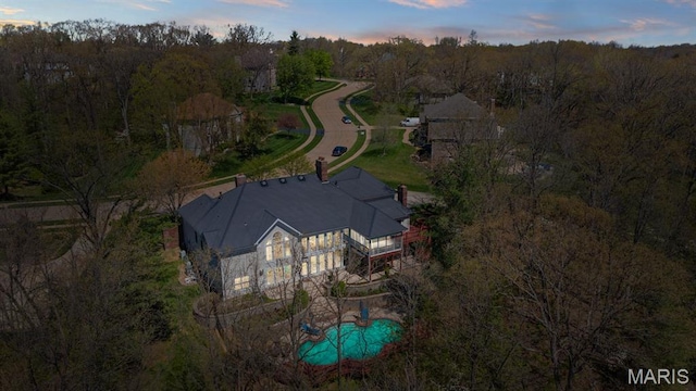 1416 Haarman Oak Dr, Wildwood, MO 63005 - aerial view at dusk of view of pool area and a wooded view