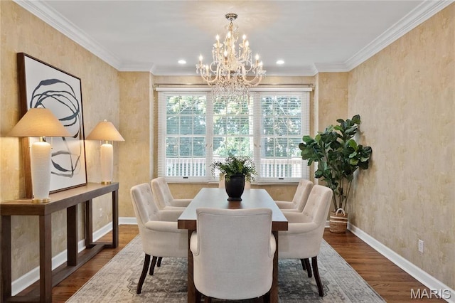 dining space featuring a chandelier, baseboards, dark wood finished floors, crown molding, and recessed lighting