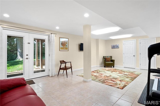 living area featuring light tile patterned floors, recessed lighting, and baseboards