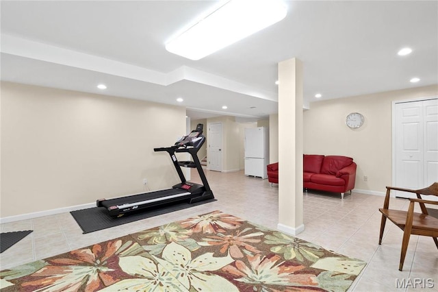 exercise area featuring recessed lighting, light tile patterned floors, and baseboards
