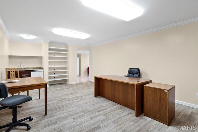 office space featuring crown molding, light wood-style floors, baseboards, and bar