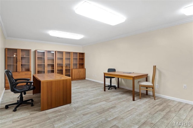 office area featuring light wood-style flooring, crown molding, and baseboards