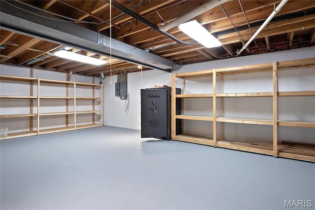 unfinished basement featuring electric panel