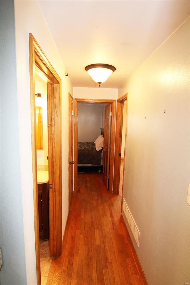 634 Ccam Rose Ln, Perryville, MO 63775 - hallway featuring wood finished floors