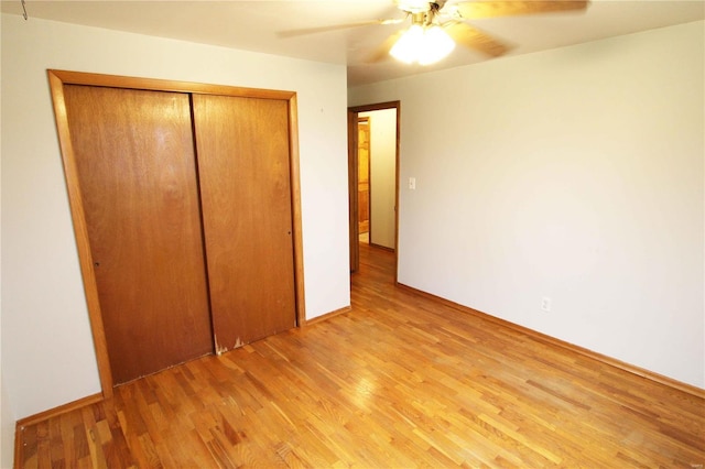634 Ccam Rose Ln, Perryville, MO 63775 - unfurnished bedroom with light wood-style floors, a closet, ceiling fan, and baseboards