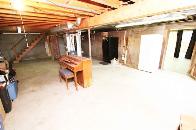 634 Ccam Rose Ln, Perryville, MO 63775 - unfinished below grade area featuring stairway and freestanding refrigerator