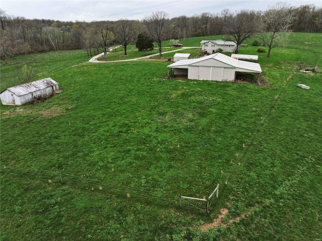 634 Ccam Rose Ln, Perryville, MO 63775 - view of green lawn with a pole building, an outdoor structure, and a view of trees