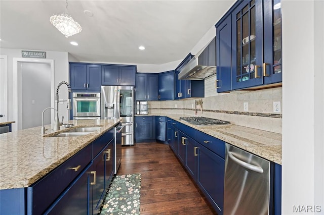 351 Oak Stand Ct, Chesterfield, MO 63005 - kitchen featuring blue cabinets, stainless steel appliances, light stone countertops, dark wood-type flooring, and a sink