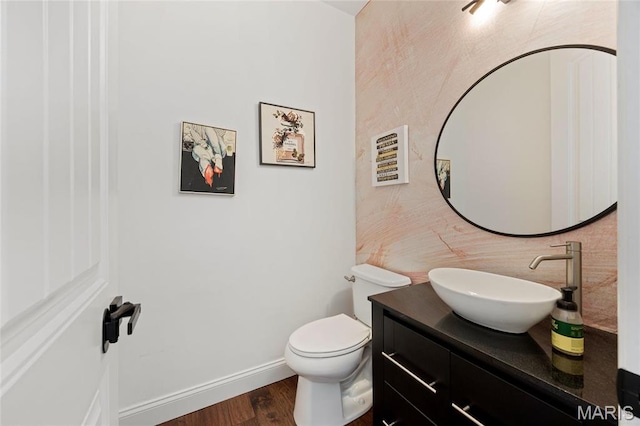 351 Oak Stand Ct, Chesterfield, MO 63005 - bathroom featuring wood finished floors, vanity, toilet, and baseboards